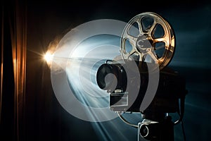 Movie projector casting light onto a cinema screen