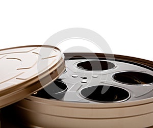 Movie reel canister on white with copy space