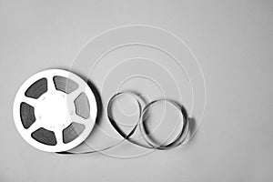 Movie reel on grey background, top view with space for text