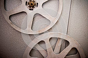 Movie reels part with filmstrip on 16 mm film projector detail