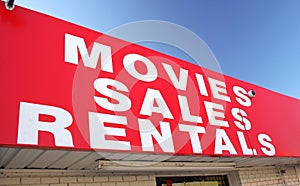 Movie Rental Sign on Convenience Store