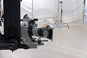 Movie shooting or video production and film crew team with camera equipment. Video camera operator working with equipment. Directo