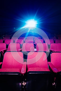 Movie Theater with empty seats and projector