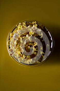 Movie time popcorn in a bowl with yellow background