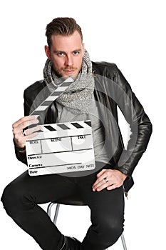 Movie worker sitting down in black jacket