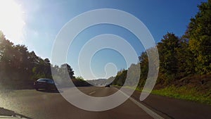 Moving on autobahn, German highway fast road, blue sky summer