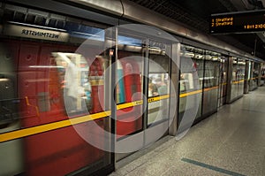 A moving blurred London Underground at Westminster Station