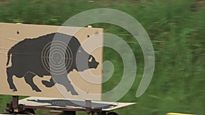 moving boar target moves across the shooting range