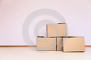 moving boxes in front of a empty wall, copyspace