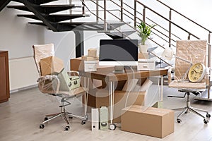 Moving boxes and furniture in office