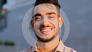 Moving camera hispanic business man happy arabian bearded guy satisfied cheerful carefree model smiling toothy looking