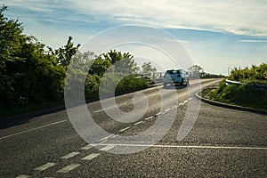 Moving car on uk motorway road countryside junction in england