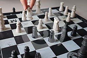 Moving a chess piece while playing a chess game at home