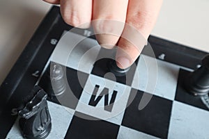 Moving a chess piece while playing a chess game at home