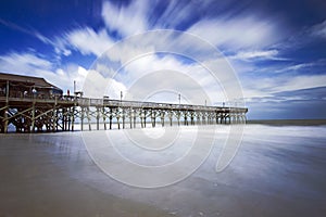 Moving clouds over boardwalk in Myrtle Beach