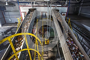 Moving conveyor transporter on Modern waste recycling processing plant. Separate and sorting garbage collection. Recycling and