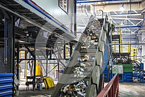 Moving conveyor transporter on Modern waste recycling processing plant. Separate and sorting garbage collection. Recycling and