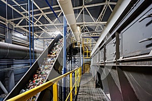 Moving conveyor transporter on Modern waste recycling processing plant. Separate and sorting garbage collection. Recycling and