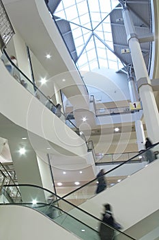 Moving crowd on escalator