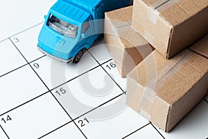Moving day. Calendar for note with cardboard boxes and truck.