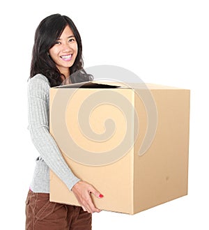 Moving day. woman with her stuff inside the cardboard box