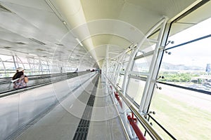 Moving escalator in an airport