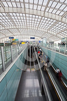 Moving escalator within the modern airport hall