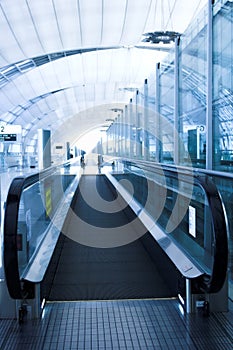 Moving escalator in the office hall