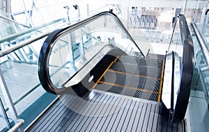 Moving escalator in the office hall