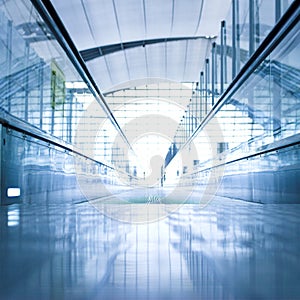 Moving escalator in the office hall