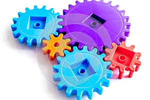 Moving forward concept, ideal operating principle with gears and wheels on white background