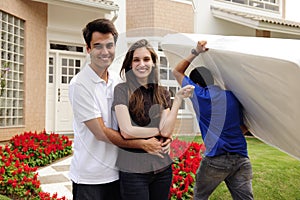 Moving home: Couple infront of new house