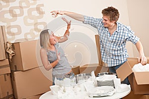 Moving house: Young couple having fun