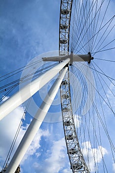 Moving London Eye on blue sky background