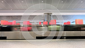 Moving luggage conveyer belt at airport baggage claim