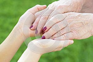 Granmother and niece holding hands