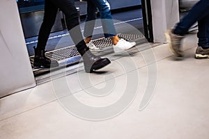 Moving people enter carriage on a subway station in Brescia Italy