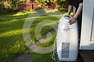 Moving a portable air conditioner