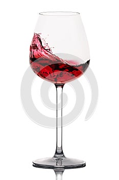 Moving red wine glass over a white background