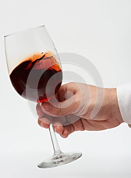 Moving red wine in stem glass