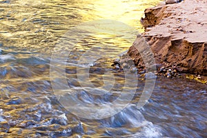 Moving River With Fall Glow