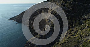 Moving side aerial view of mediterranean sea wild green rocky coast. Nature environment outdoors travel establisher, Italy