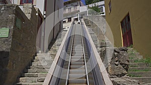 Moving staircase Monte dos Judeus ascends to top of hill in Porto, Portugal. Escadas Monte dos Judeus mechanised