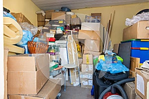 Moving, things packed in boxes and packages lie in a small room