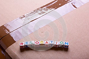 Moving to another office or house. Word relocation