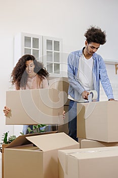 moving to new apartment relocation. happy couple an African American man and woman