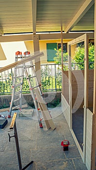 Moving to a new house. Outdoor patio pergola shade structure, patio roof and wooden gazebo under construction, garden lounge