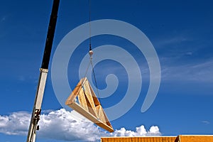 Moving trusses and rafters with a sky hook