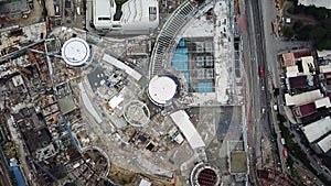 Moving up aerial topdown Kuala Lumpur city center building construction