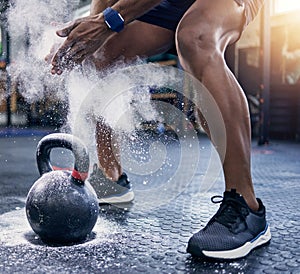 Moving up to the heavier weights. Closeup shot of an unrecognisable man dusting his hands with sports chalk while